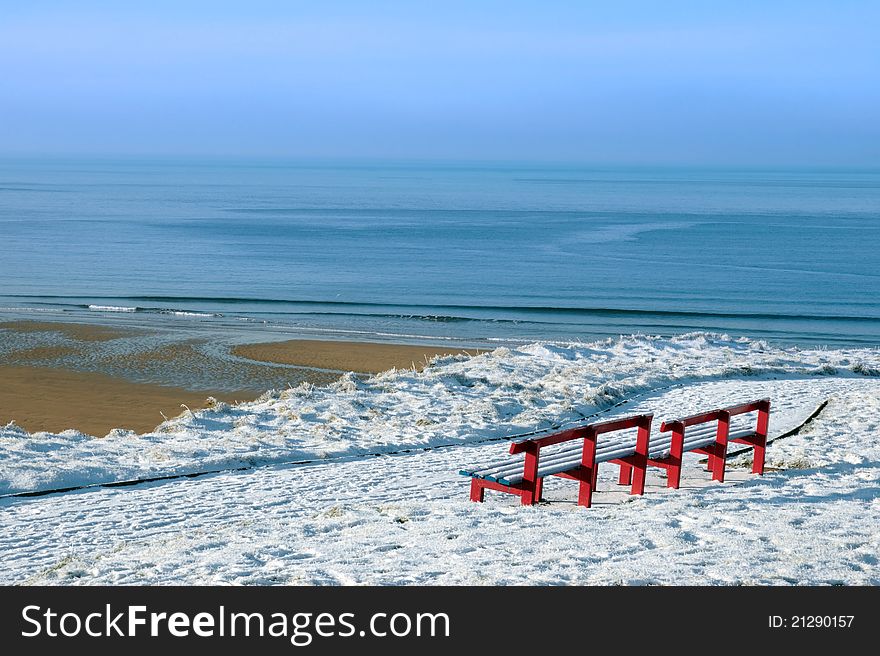 Atlantic winter view and red benches