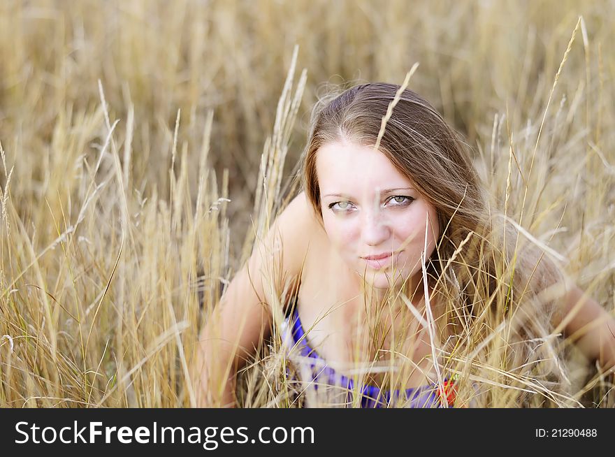 This photo shows the girl that lies in the grass on the nature. This photo shows the girl that lies in the grass on the nature