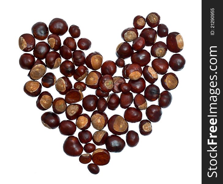 Heart from chestnuts isolated on white background