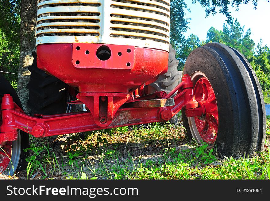 Old tractor setting in field