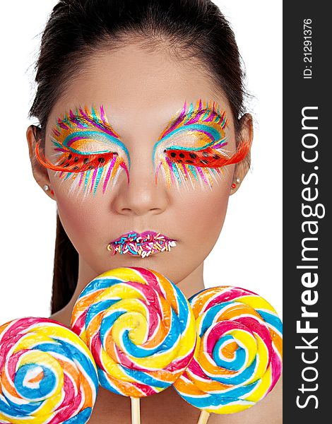 Asian female with three colorful lollipop. Asian female with three colorful lollipop