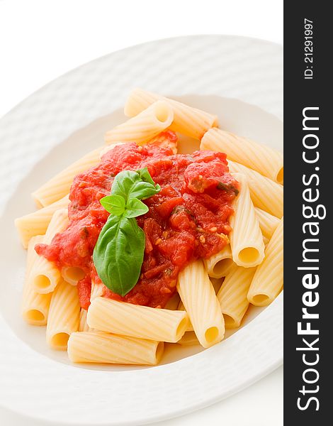 Photo of delicious pasta with basil and tomato sauce on white background. Photo of delicious pasta with basil and tomato sauce on white background