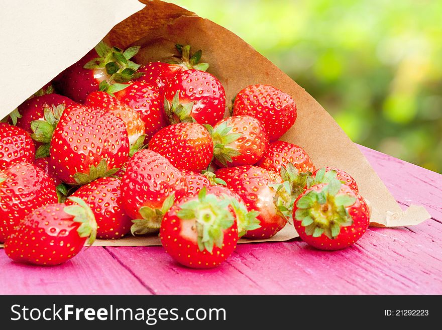 Fresh strawberries in a paper bag