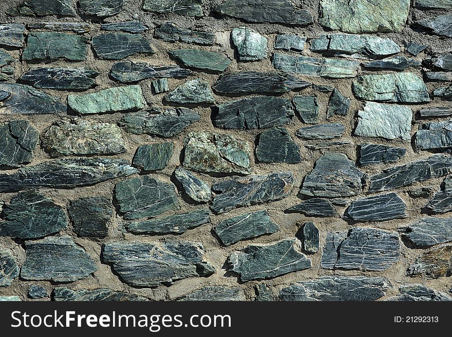 Close-up of a wall made from natural rocks. Close-up of a wall made from natural rocks