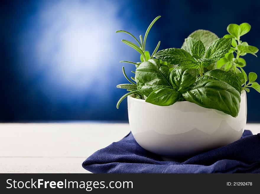 Photo of delicious different herbs inside a bowl ready to be processed. Photo of delicious different herbs inside a bowl ready to be processed