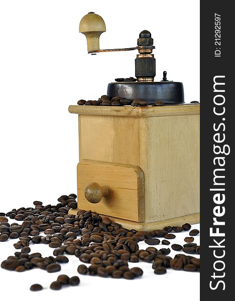 Coffee grinder and coffee beans on the white background