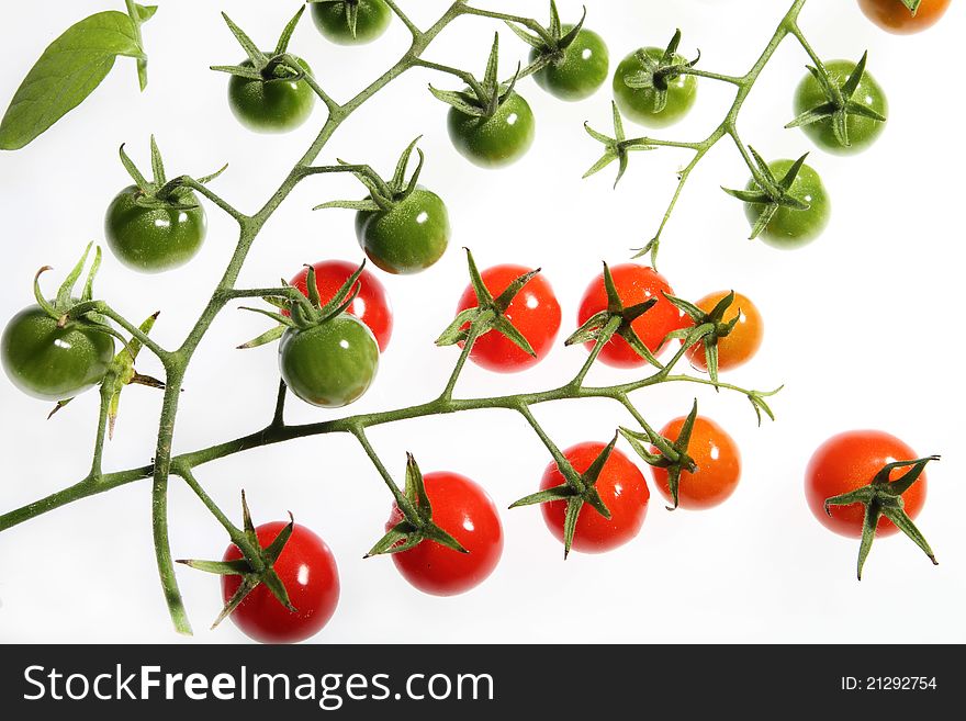 Background of red and green vine cherry tomatoes