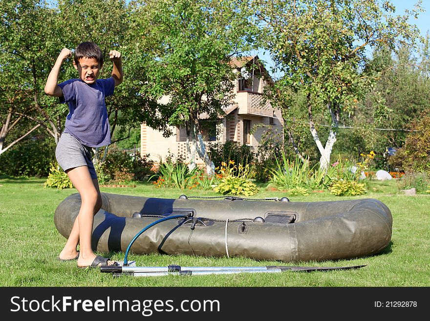 Boy inflate boat and show power