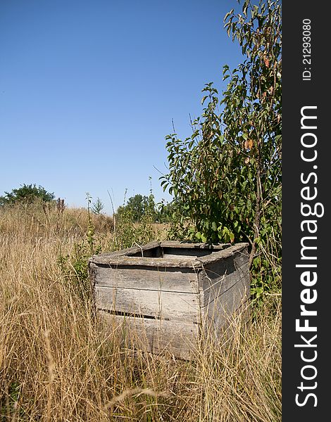 Abandoned rustic dry water well. Abandoned rustic dry water well