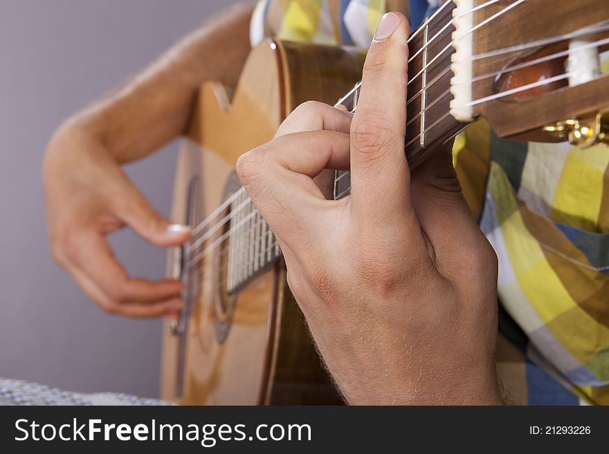 Really great shot capturing detail of a guitarist - shot in studio