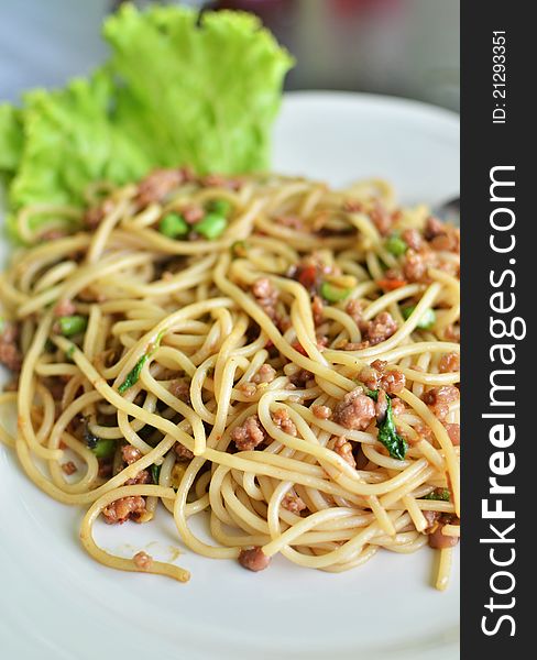 Spicy fried spaghetti with pork , Asian style food