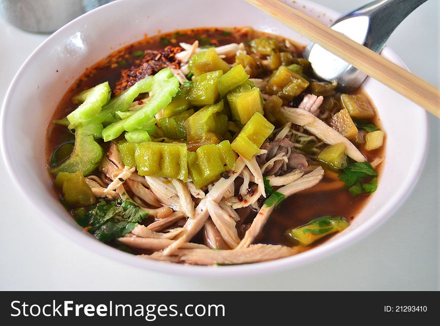 Asian style noodle with chicken and bitter soup
