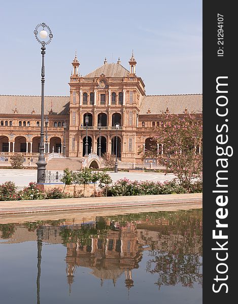 Detail of the building and the moat that surround Plaza de Espana (Spain square) in Seville. It was designed by Anibal Gonzalez for the Ibero-American Exposition World's Fair. Detail of the building and the moat that surround Plaza de Espana (Spain square) in Seville. It was designed by Anibal Gonzalez for the Ibero-American Exposition World's Fair.