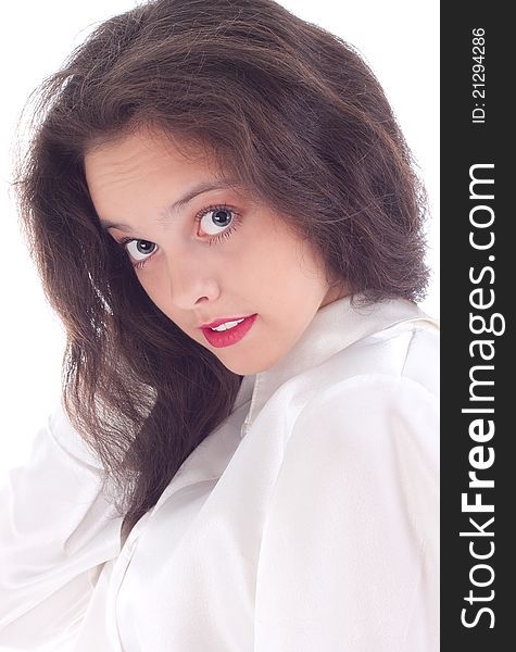 Beautiful young woman with surprise stares at a white background