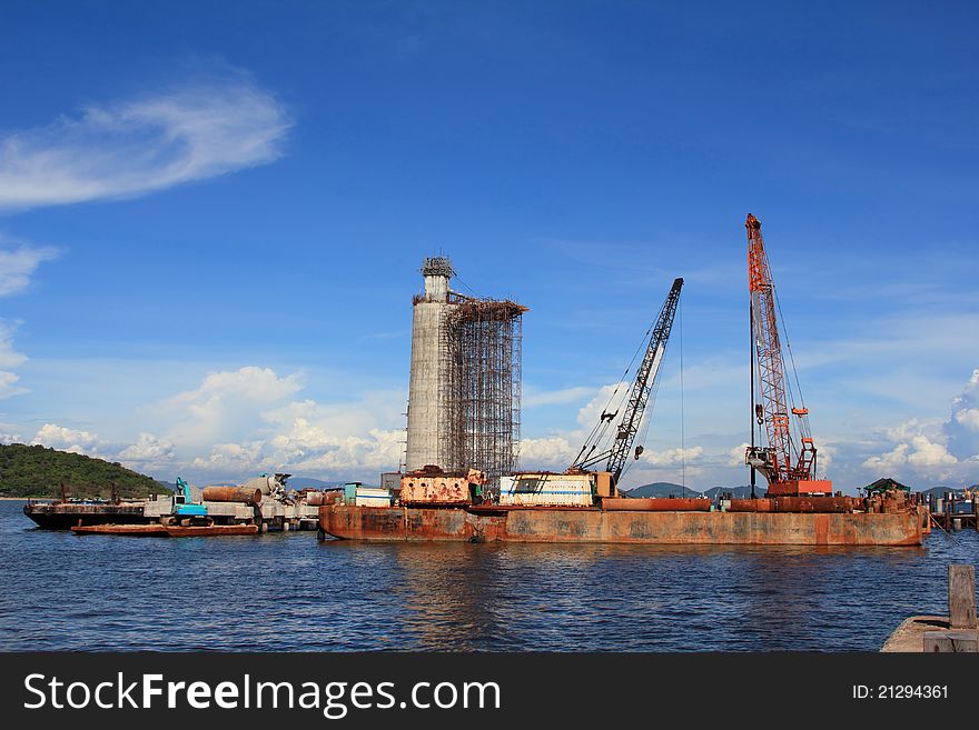 The lighthouse under construction with blue sky