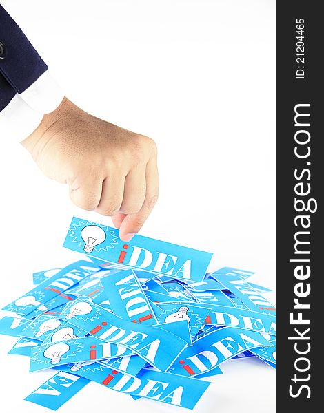 Hand picks up the paper with a word idea 
It's isolated on white background
Business concept. Hand picks up the paper with a word idea 
It's isolated on white background
Business concept