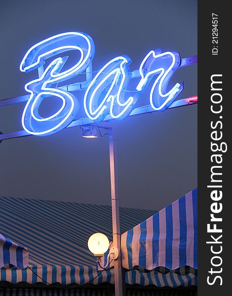 Bright blue advertisement light with the word BAR. Bright blue advertisement light with the word BAR