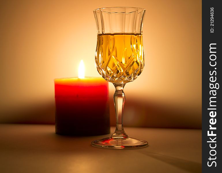 A candle gives light to a fine liquor. A candle gives light to a fine liquor.