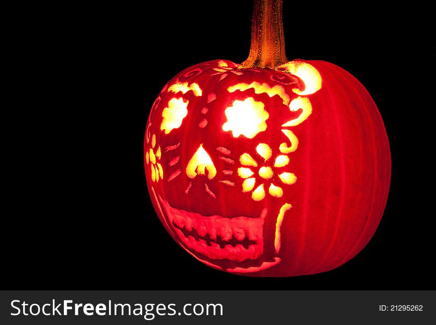 Happy Jack O' Lantern with intricate pattern carved out. Happy Jack O' Lantern with intricate pattern carved out.