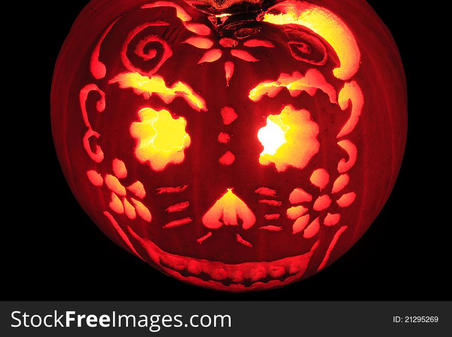 Happy Jack O' Lantern with intricate pattern carved out. Happy Jack O' Lantern with intricate pattern carved out.