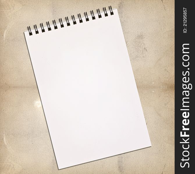 White notebook for painting on vintage background