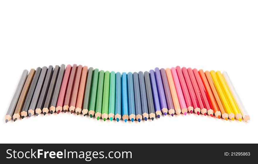 Set of color pencils on white background