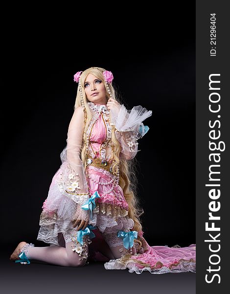 Attractive young girl posing in fairy-tale ball joint doll cosplay costume. Attractive young girl posing in fairy-tale ball joint doll cosplay costume