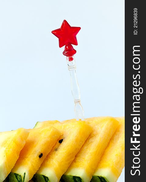 Slice yellow watermelon on blue background