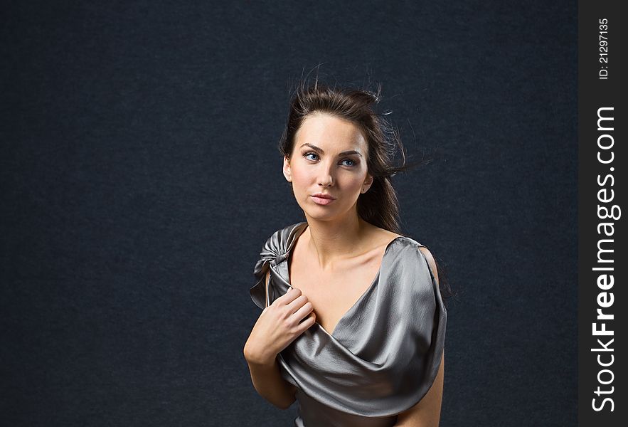 Woman in grey evening dress.