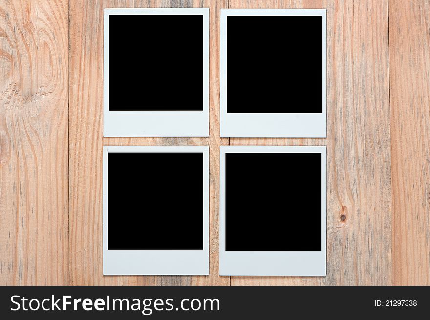 Photoframe On Wooden Background.