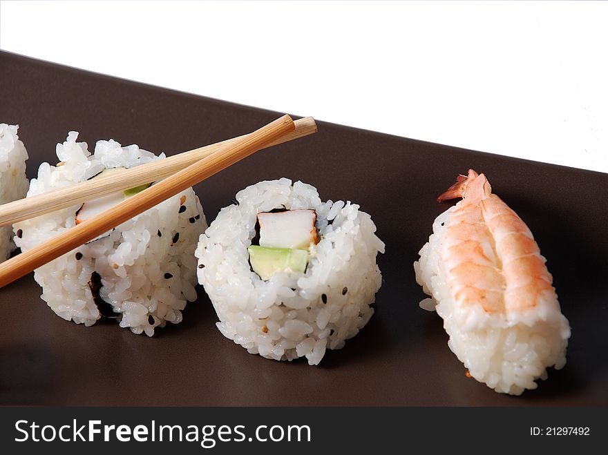 Sushi on a brown dish