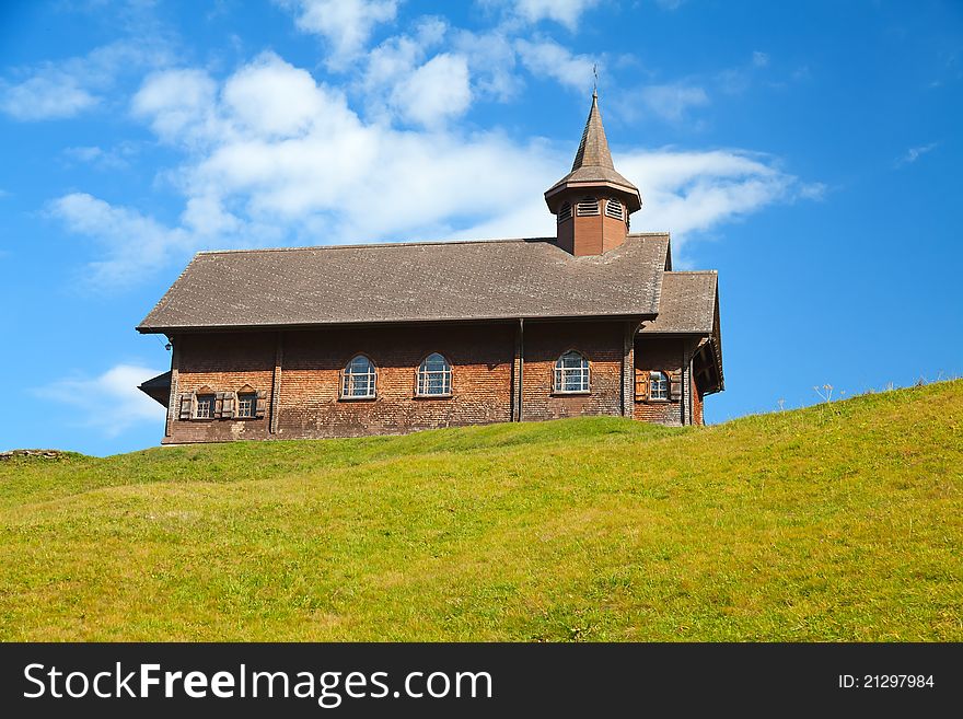 Small wooden church in swiss alps