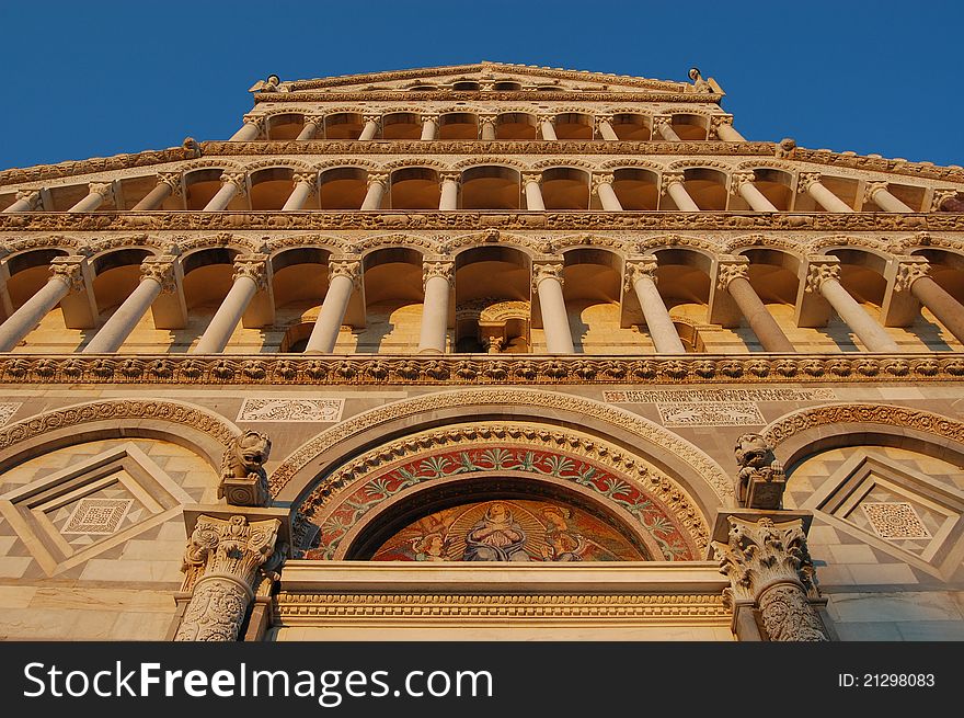 Sunset on the front facade of the Duomo, Pisa