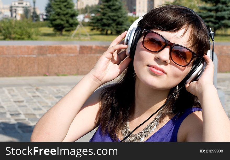 Girl listening music in headphones