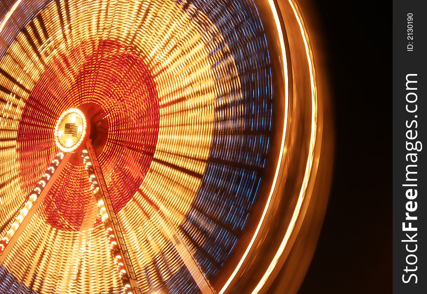 Nighttime blur of a ferris wheel. Nighttime blur of a ferris wheel