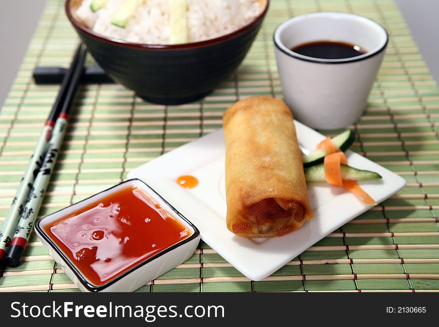 Crispy Chinese egg rolls with sweet and tangy chili sauce for dipping. Crispy Chinese egg rolls with sweet and tangy chili sauce for dipping.