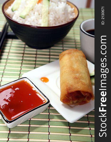 Crispy Chinese egg rolls with sweet and tangy chili sauce for dipping. Crispy Chinese egg rolls with sweet and tangy chili sauce for dipping.