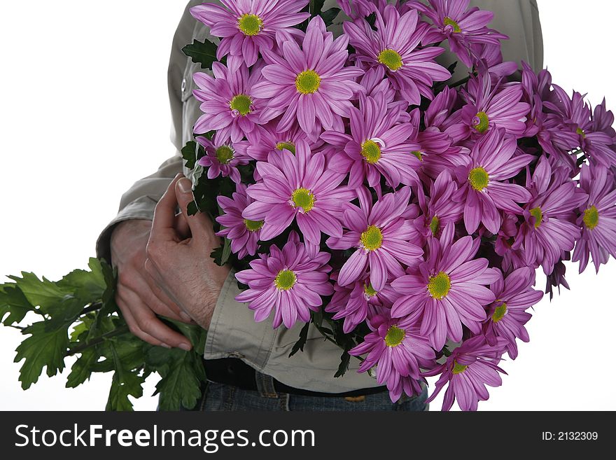 Man holding bouquet of flowers in his arms. Man holding bouquet of flowers in his arms