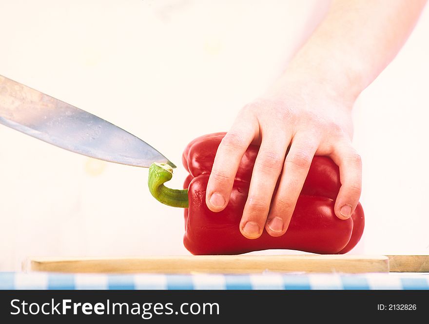 Cook cuts salad pepper for preparation of  dish