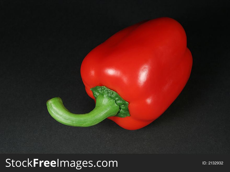 Red bell pepper on black background. Red bell pepper on black background