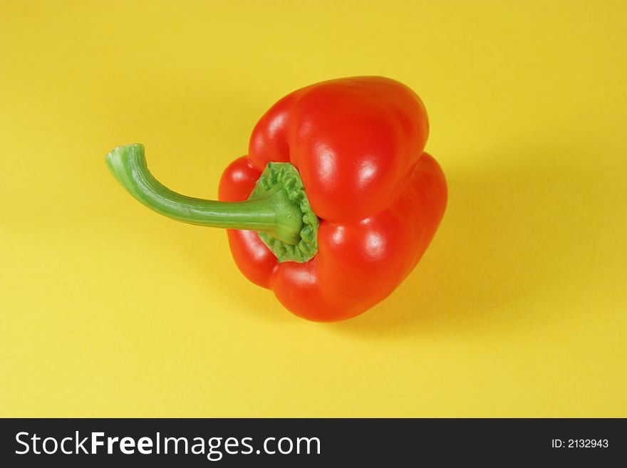 Red bell pepper on yellow
