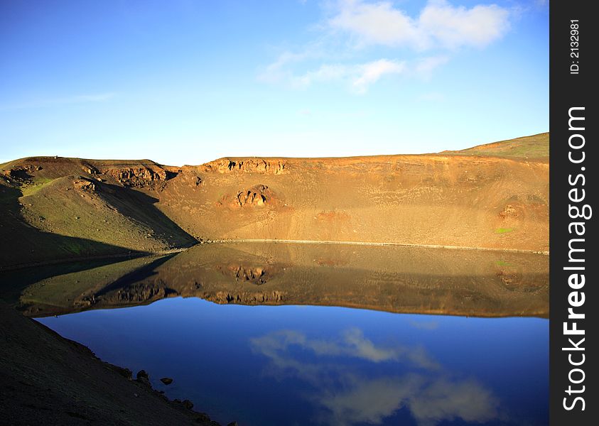 Reflection in volcano crater Krafla Iceland