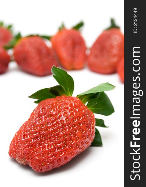 Bunch of Strawberries. Front one focused. Isolated on a white background. Bunch of Strawberries. Front one focused. Isolated on a white background.