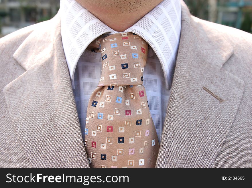 A businessman, clothing. Closeup of a tie and shirt