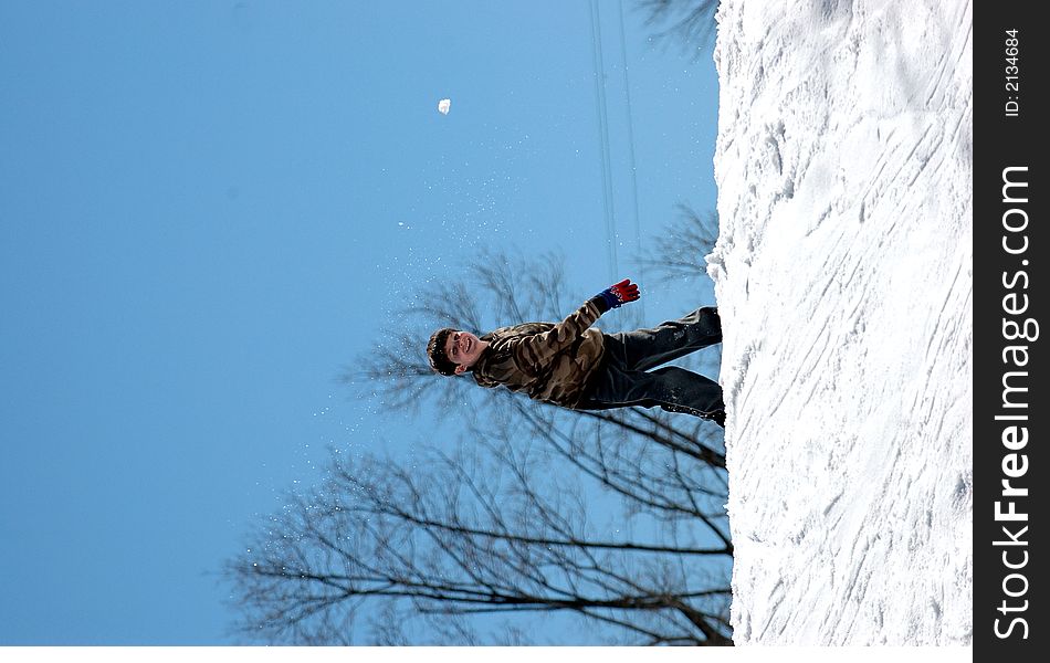 Boy throwing snowball