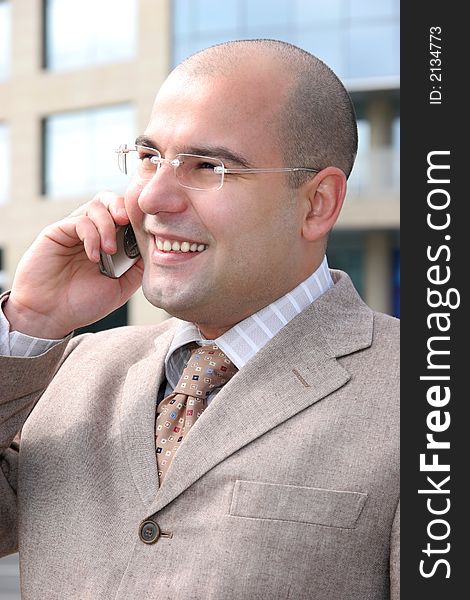 A businessman calling by mobile phone