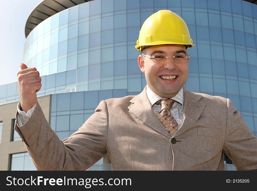 Successful an businessman with helmet. Successful an businessman with helmet