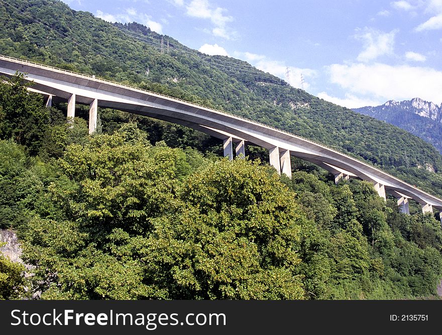 Sophisticated highway hanged on mountainside along Geneva Lake in Switzerland. Sophisticated highway hanged on mountainside along Geneva Lake in Switzerland