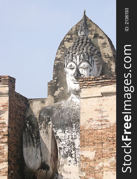 Ancient Stone Buddha Standing in Brick walls. Ancient Stone Buddha Standing in Brick walls