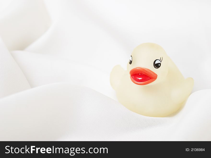 Image of rubber duck in soft white cloth. Image of rubber duck in soft white cloth